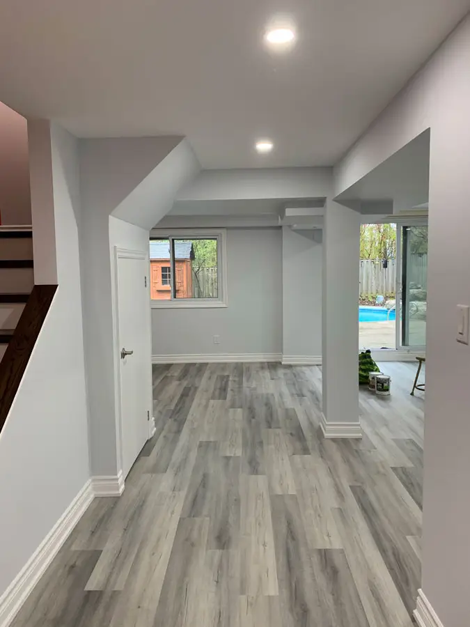 Ferreira basement renovation hallway and finished lower-level space